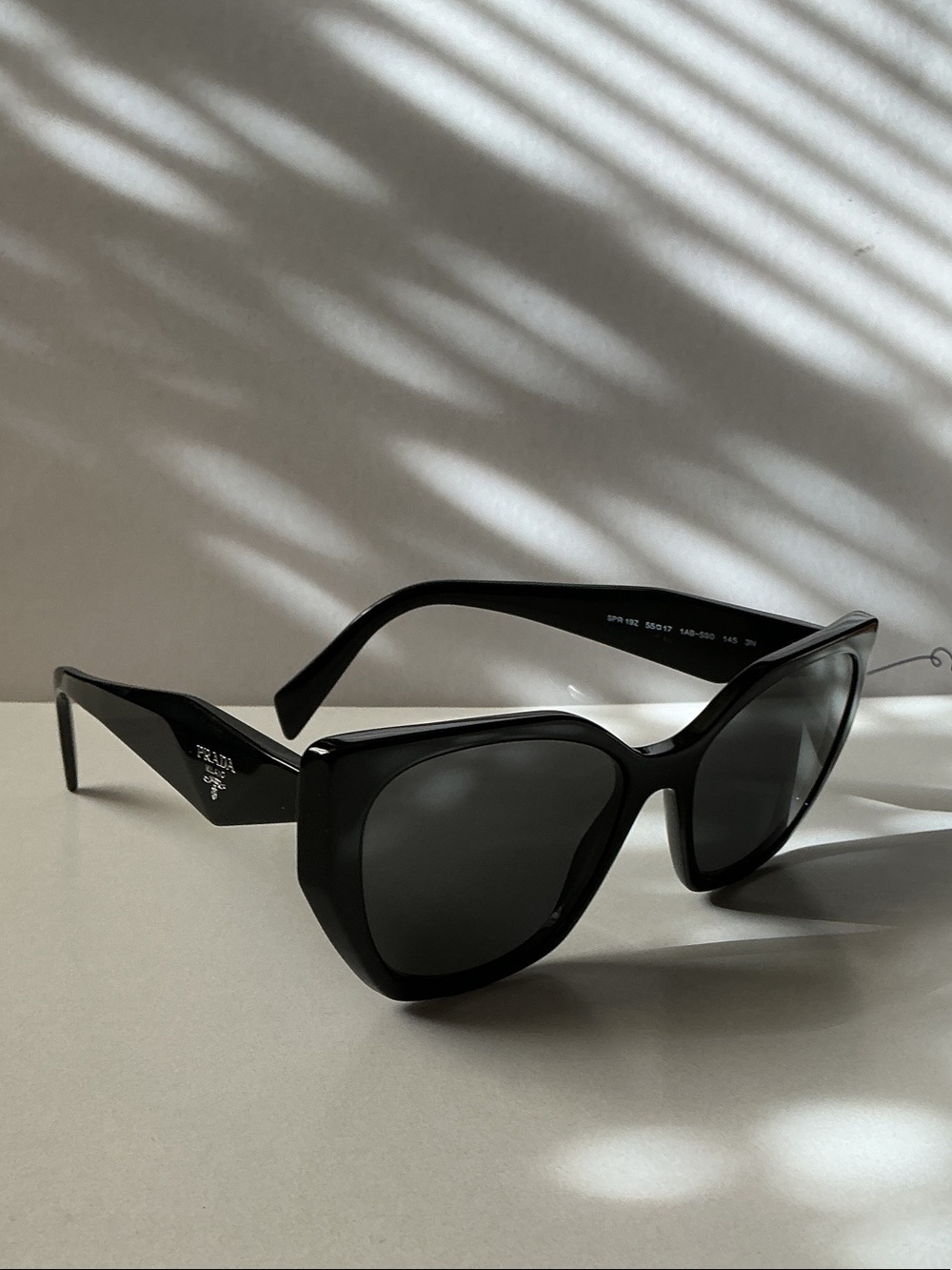 Prada Black Cat-Eye Sunglasses with Dark Lenses